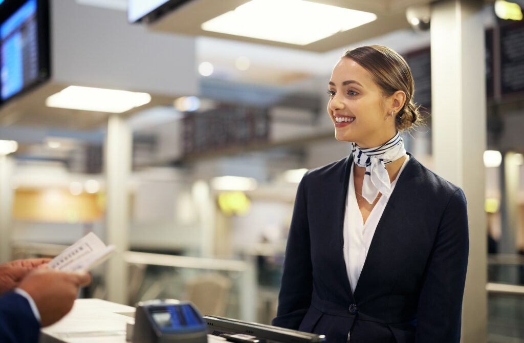 Atlanta Airport, help desk and woman with customer services, ticket booking and schedule with client communicating
