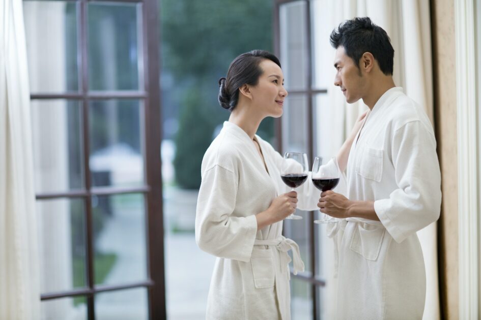 Loving couple with wine in a luxury Atlanta airport hotel
