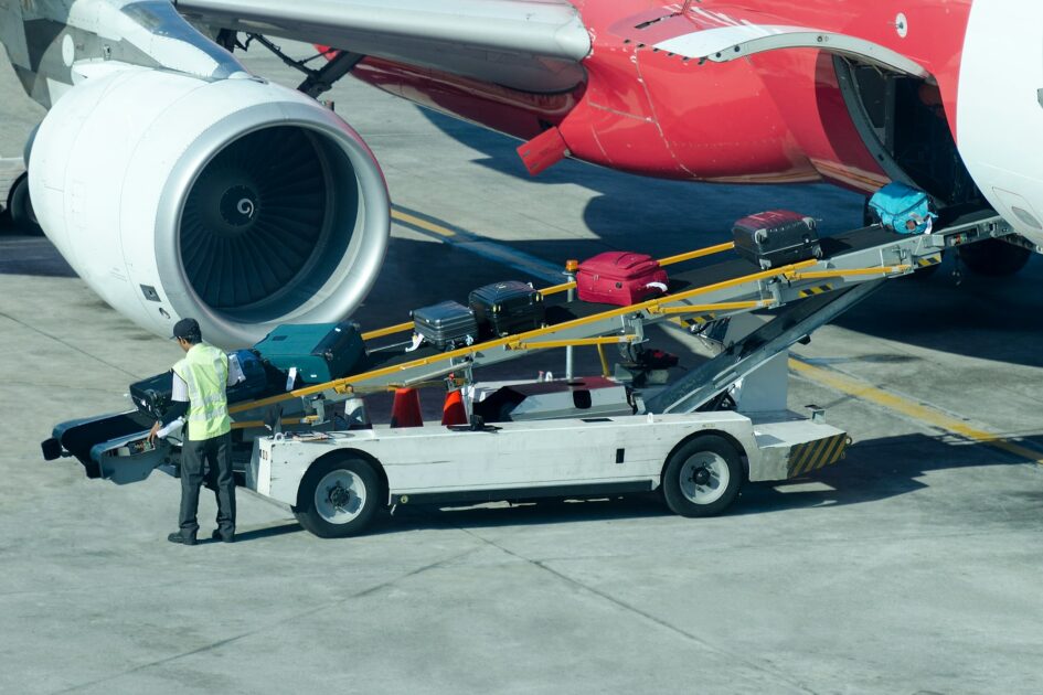 Worker loads the luggage in the plane at Atlanta Airport