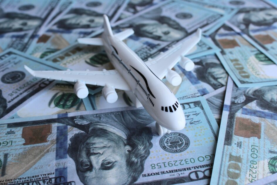 Selective focus image of toy plane and money